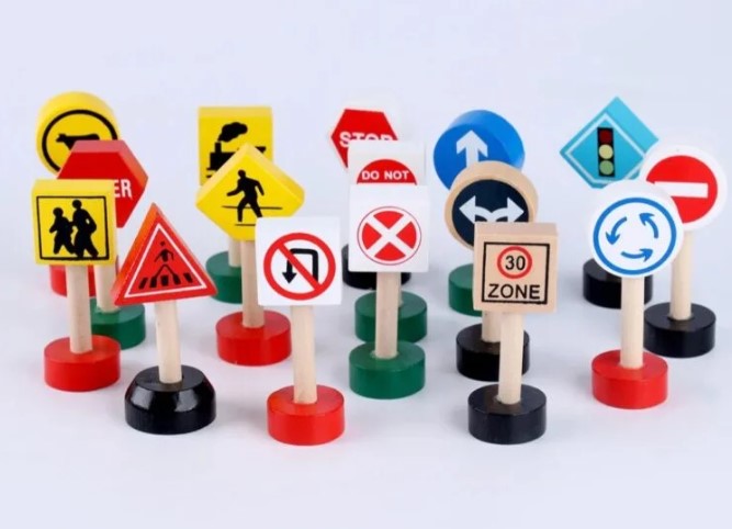 Learning road safety , wooden sign boards , Traffic Signs